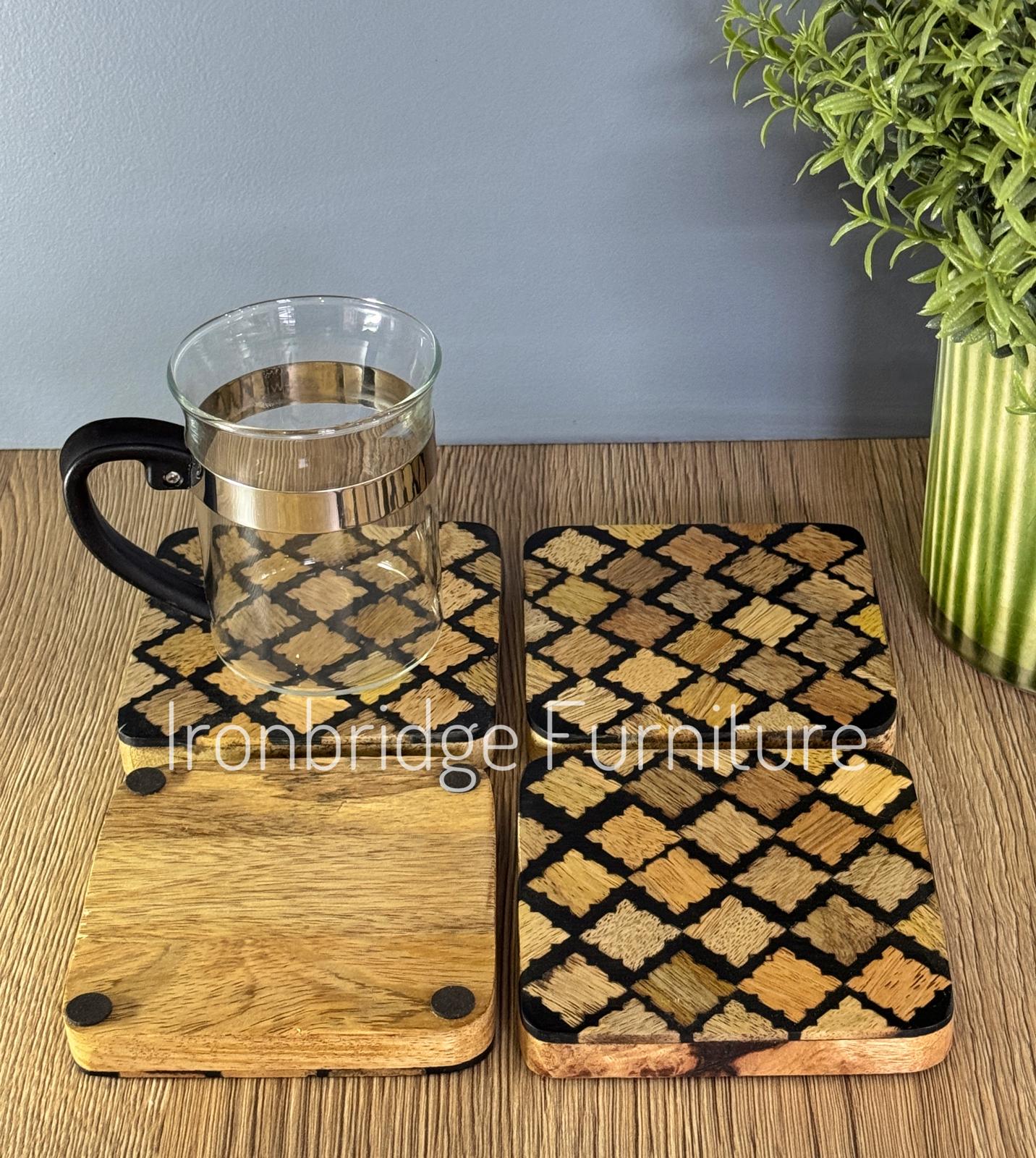 Set of 4 resin coasters with Mango wood inlay and base. With glass and showing base.