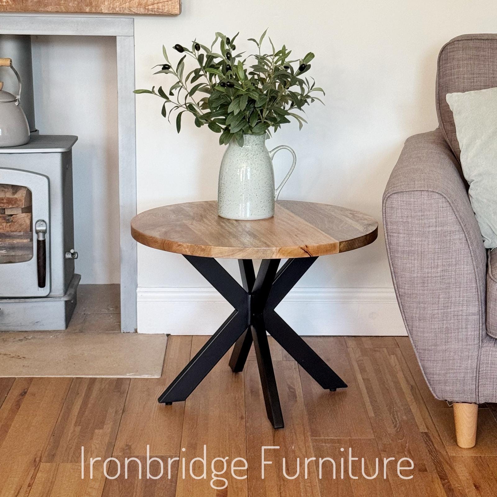 60cm round Mango wood top coffee table with black metal legs.