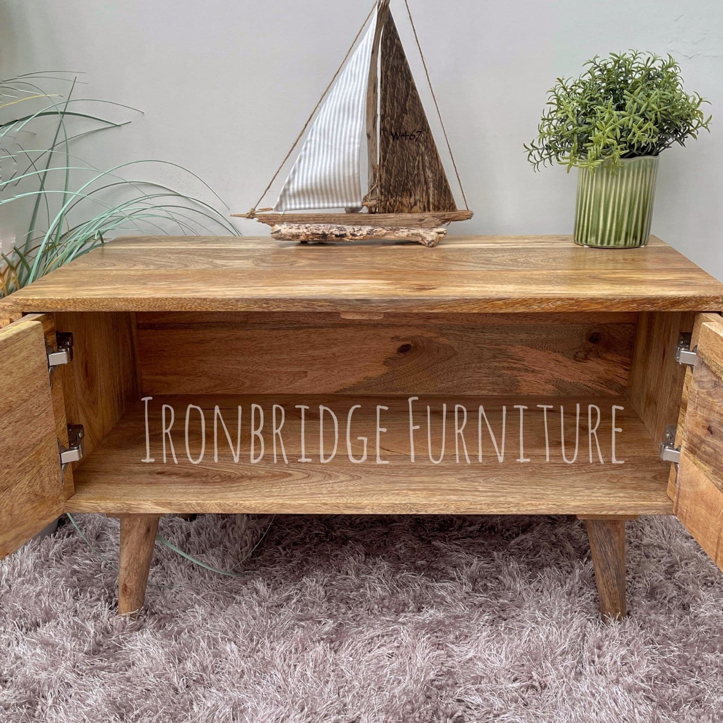 Patterned front TV stand with doors open