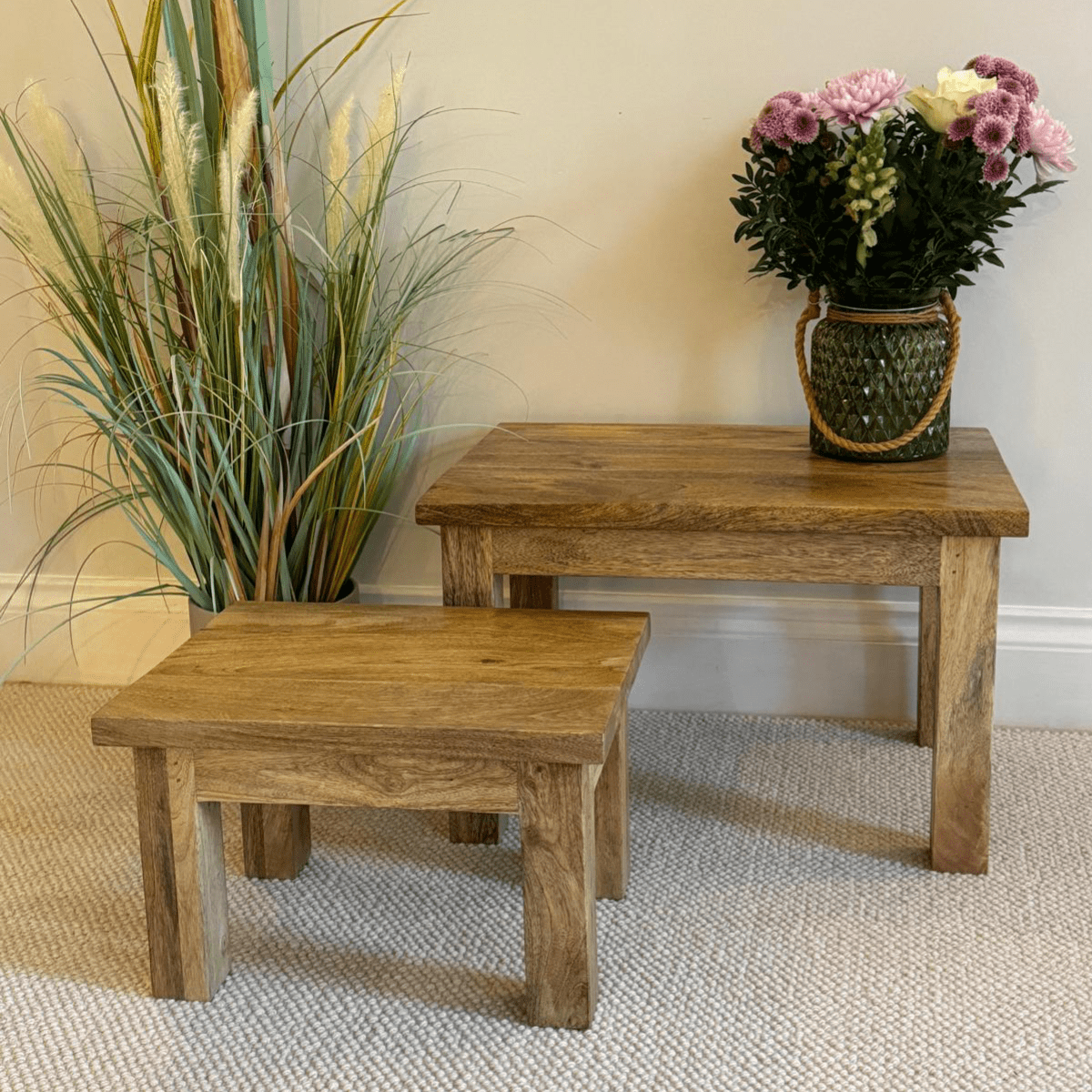Pair of square finish Mango wood coffee tables in a room setting