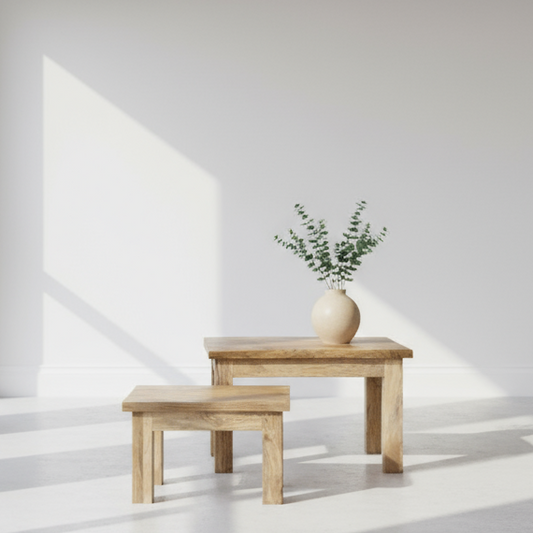 Pair of square finish Mango wood coffee tables in a room setting