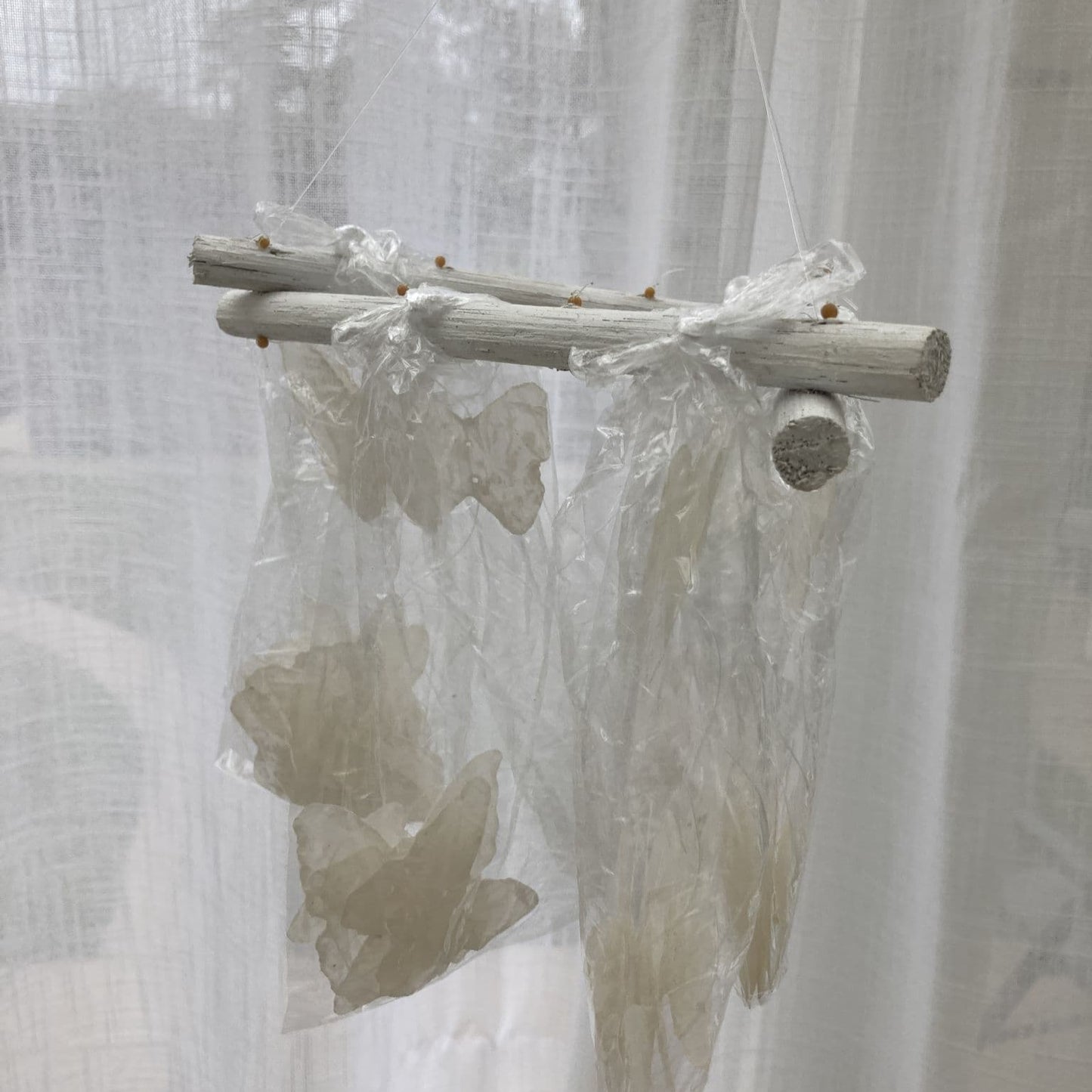 Natural Capiz shell wind chime Butterfly design - white. Packaged.