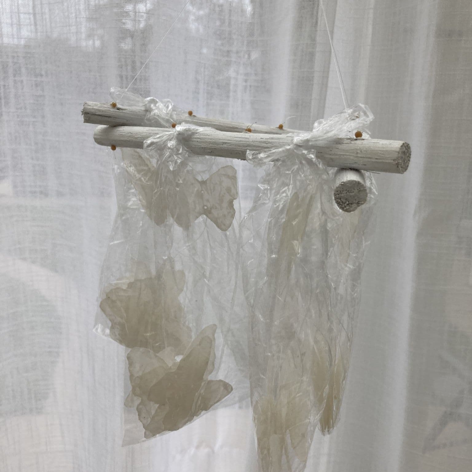 Natural Capiz shell wind chime Butterfly design - white. Packaged.