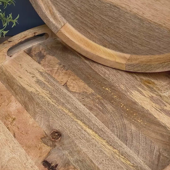 A close up of a Solid Mango wooden round tray