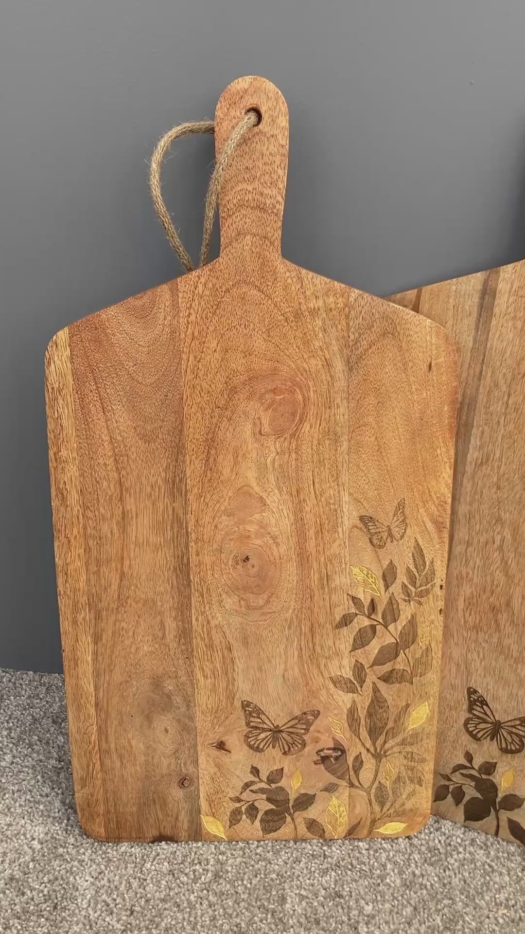 Video of Floral design etched Mango wood food serving paddle board
