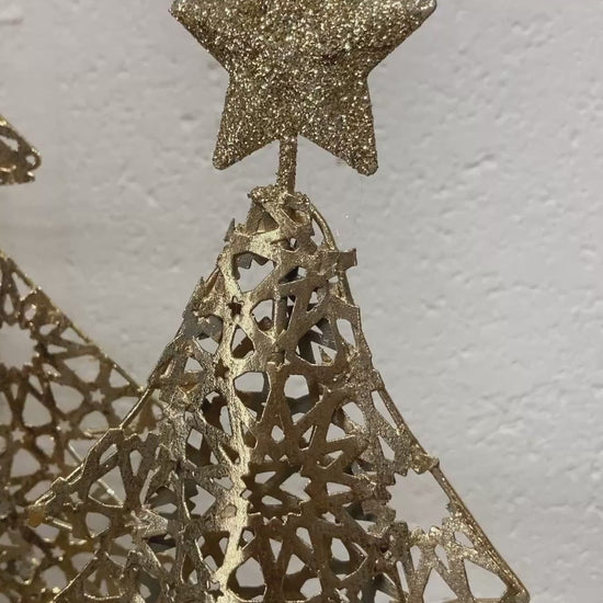 Gold metal Christmas tree on wood log base - video.